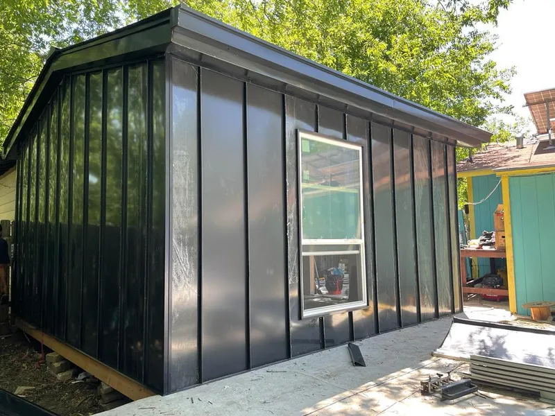 Black standing seam metal wall panels for Roof Inspection in McKees Rocks